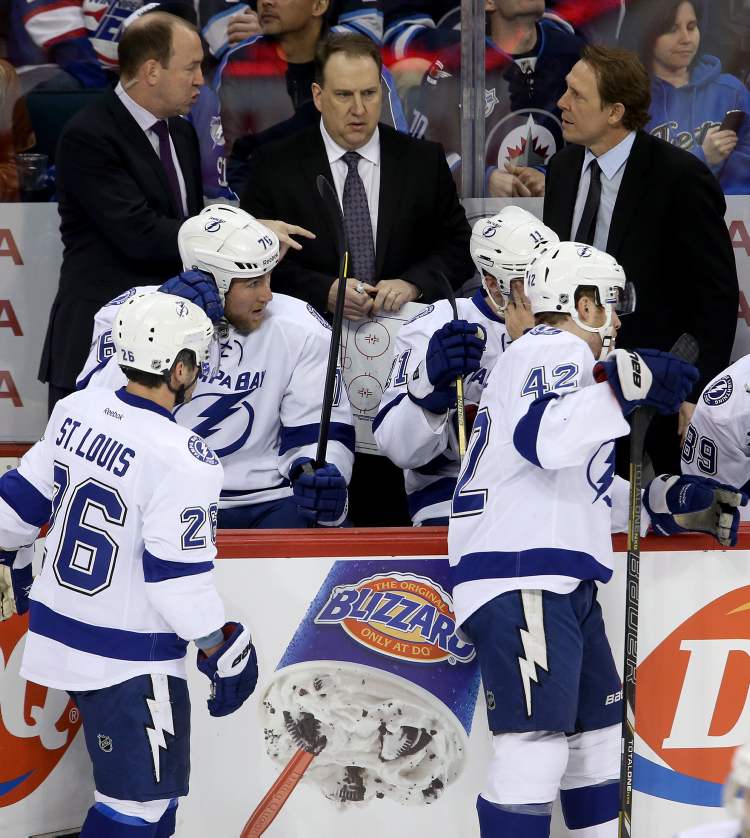 Trevor Hagan / THE CANADIAN PRESS
Tampa Bay Lightning assistant coaches Daniel Lacroix and Martin Raymond and player development coach Steve Thomas in place of fired head coach, Guy Boucher, during first-period NHL action against the Winnipeg Jets' in Winnipeg, Sunday.