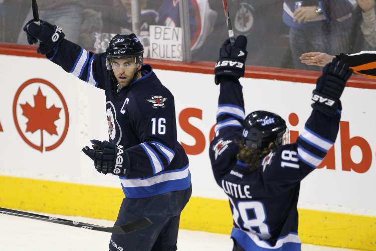 JOHN WOODS / WINNIPEG FREE PRESS
Winnipeg Jets' Bryan Little (left) and Andrew Ladd celebrate Little's goal against the Tampa Bay Lightning during first-period NHL action in Winnipeg on Sunday.