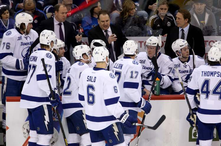 Trevor Hagan / THE CANADIAN PRESS
Tampa Bay Lightning assistant coaches, Daniel Lacroix and Martin Raymond and player development coach Steve Thomas in place of fired head coach, Guy Boucher, during NHL action against the Winnipeg Jets in Winnipeg, Sunday.
