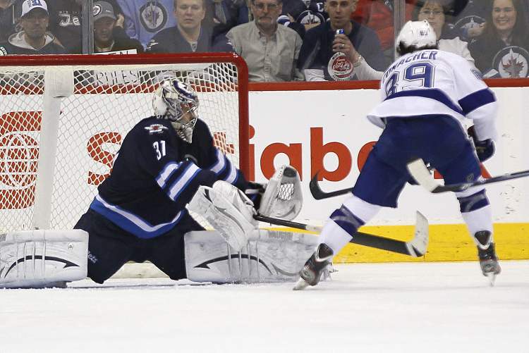 JOHN WOODS / WINNIPEG FREE PRESS
Winnipeg Jets goaltender Ondrej Pavelec shuts down the breakaway shot from Tampa Bay Lightning's Cory Conacher during second-period NHL action in Winnipeg on Sunday.