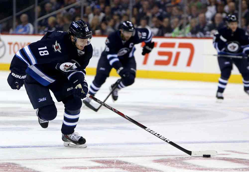 TREVOR HAGAN / THE CANADIAN PRESS
Winnipeg Jets' Bryan Little skates into the Anaheim Ducks' zone on a breakaway during the second period.