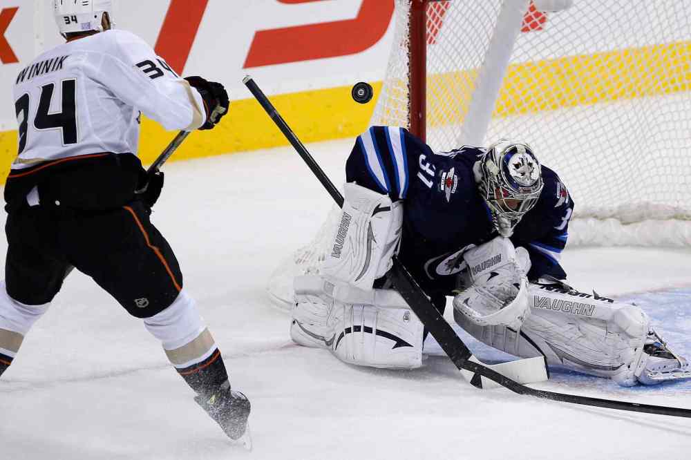 JOHN WOODS / WINNIPEG FREE PRESS
Winnipeg Jets' goaltender Ondrej Pavelec gets his shoulder on a shot from Anaheim Ducks' Daniel Winnik during the first period.