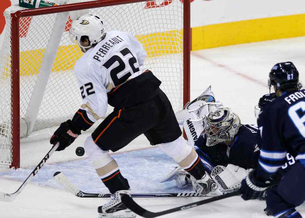 JOHN WOODS / WINNIPEG FREE PRESS
Ondrej Pavelec can't stop the shot from Anaheim Ducks' Mathieu Perreault in the first period.