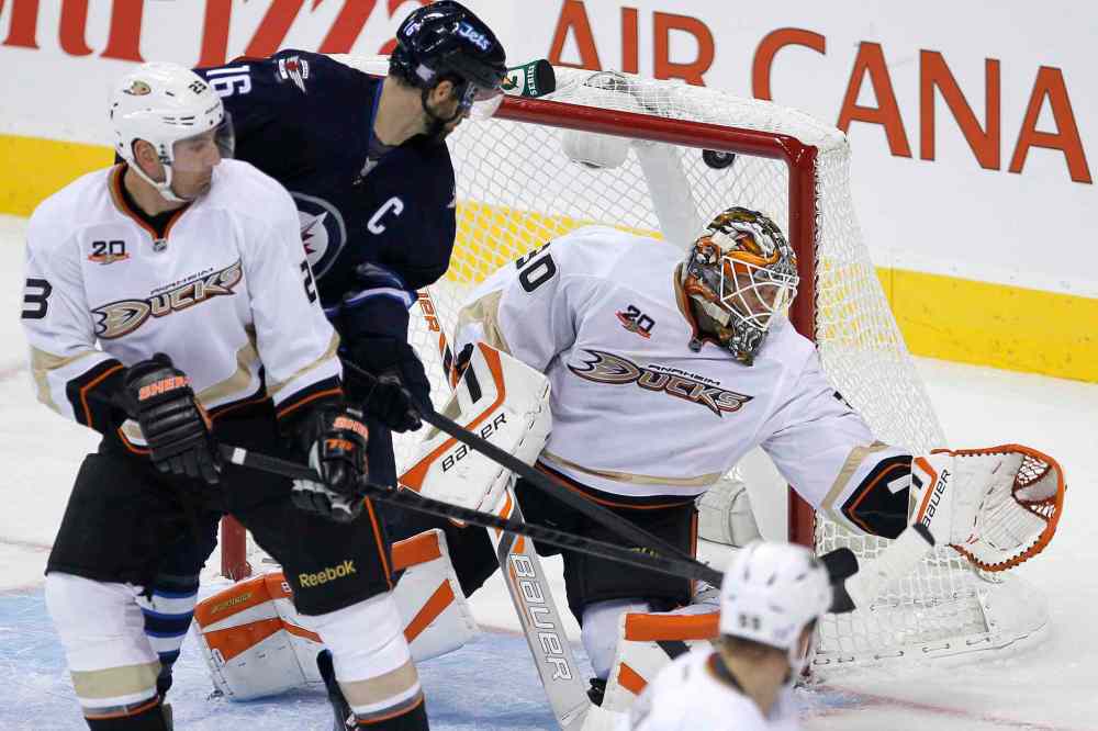 JOHN WOODS / WINNIPEG FREE PRESS
Winnipeg Jets' Andrew Ladd tips Blake Wheeler's shot past Anaheim Ducks goaltender Viktor Fasth as Francois Beauchemin defends in the first period.