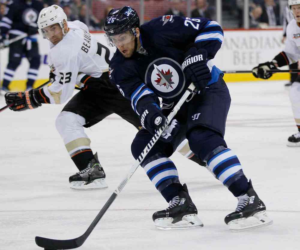 JOHN WOODS / WINNIPEG FREE PRESS
Anaheim Ducks' Francois Beauchemin keeps a eye on Winnipeg Jets' Blake Wheeler as he moves in on a breakaway during the second period.