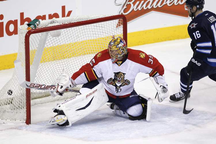 JOHN WOODS / THE CANADIAN PRESS
Winnipeg Jets captain Andrew Ladd scores on Florida Panthers goaltender Jacob Markstrom during the first period in Winnipeg on Thursday.