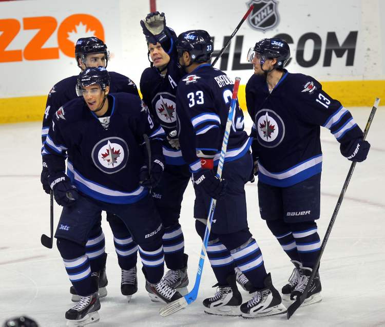 Phil Hossack / WInnipeg Free Press
Winnipeg Jets Evander Kane, Grant Clitsome, Olii Jokinen, Dustin Byfuglien and Kyle Wellwood celbrate Kane's goal in the first period against the Florida Panthers.