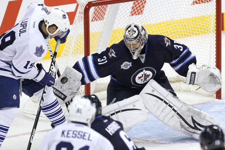 John Woods / Winnipeg Free Press
Winnipeg Jets' goaltender Ondrej Pavelec stops a shot from Toronto Maple Leafs' Joffrey Lupul (19) during third-period action Tuesday.