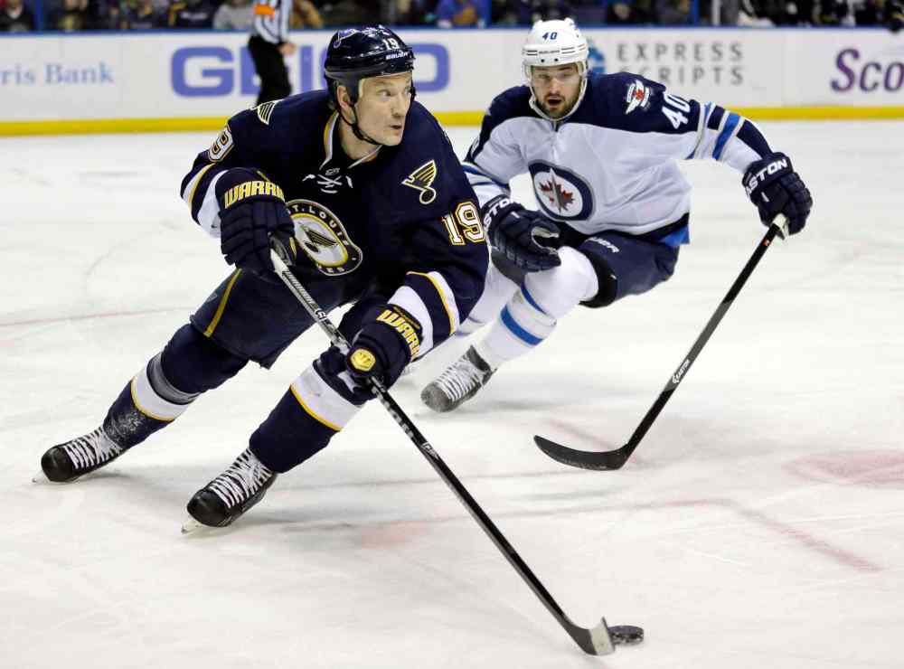Jeff Roberson / The Associated Press
St. Louis Blues' Jay Bouwmeester, left, controls the puck as Winnipeg Jets' Devin Setoguchi gives chase during the first period of Saturday's game.