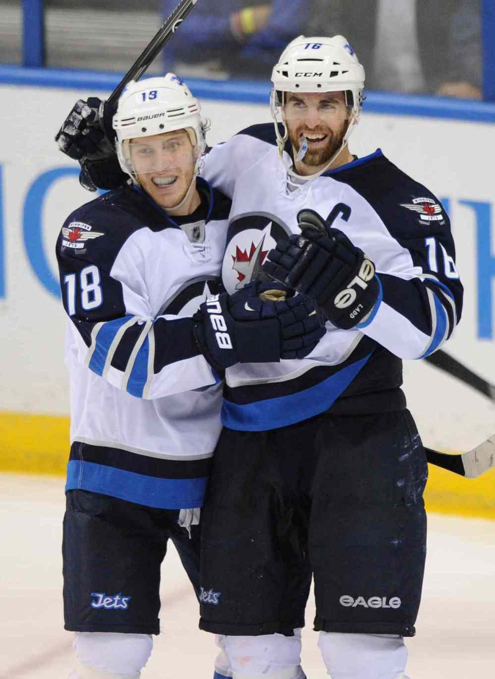 Bill Boyce / the associated press
Winnipeg Jets forward Bryan Little (18) celebrates his goal with teammate Andrew Ladd.