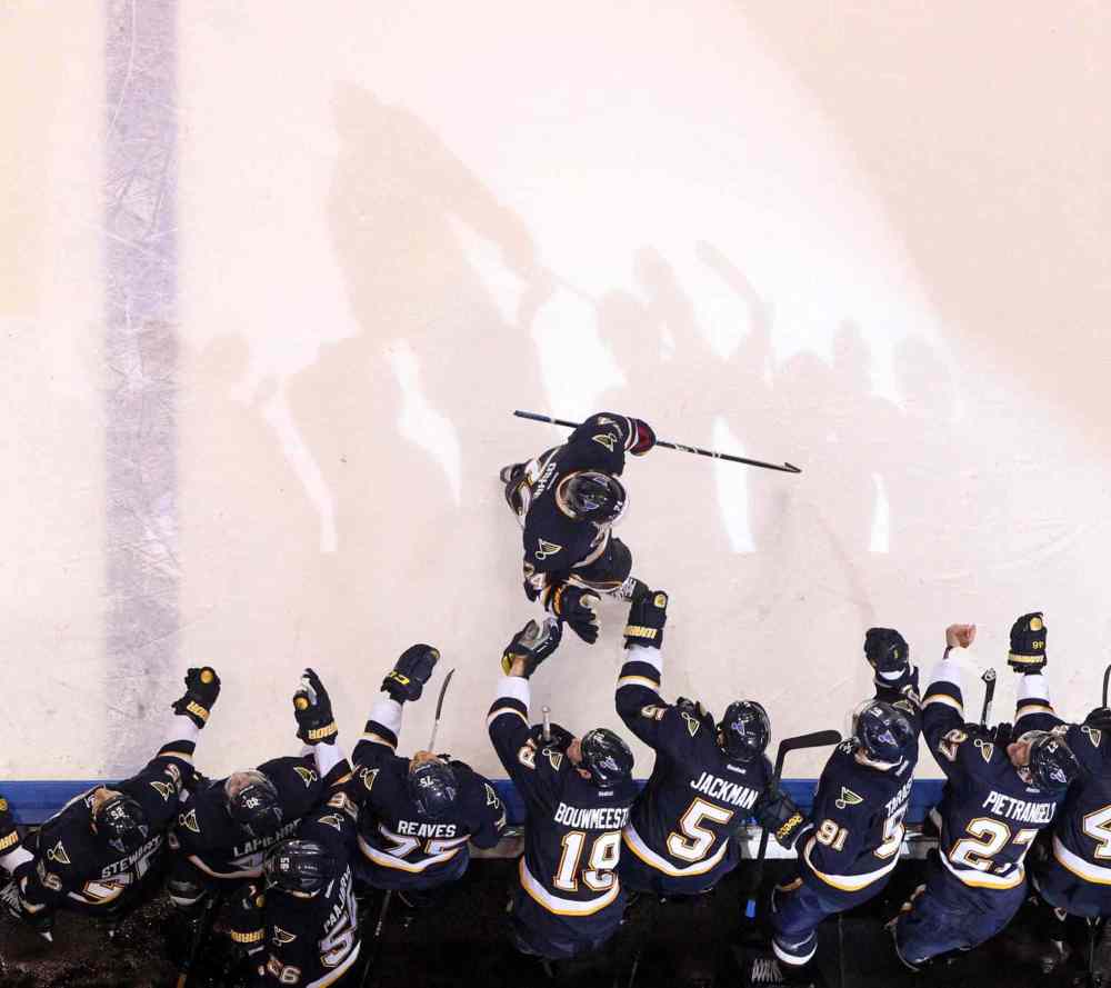 Chris Lee/St. Louis Post-Dispatch/MCT
T.J. Oshie of the St. Louis Blues is congratulated by teammates after scoring a shootout goal against the Winnipeg Jets on Saturday in St. Louis.