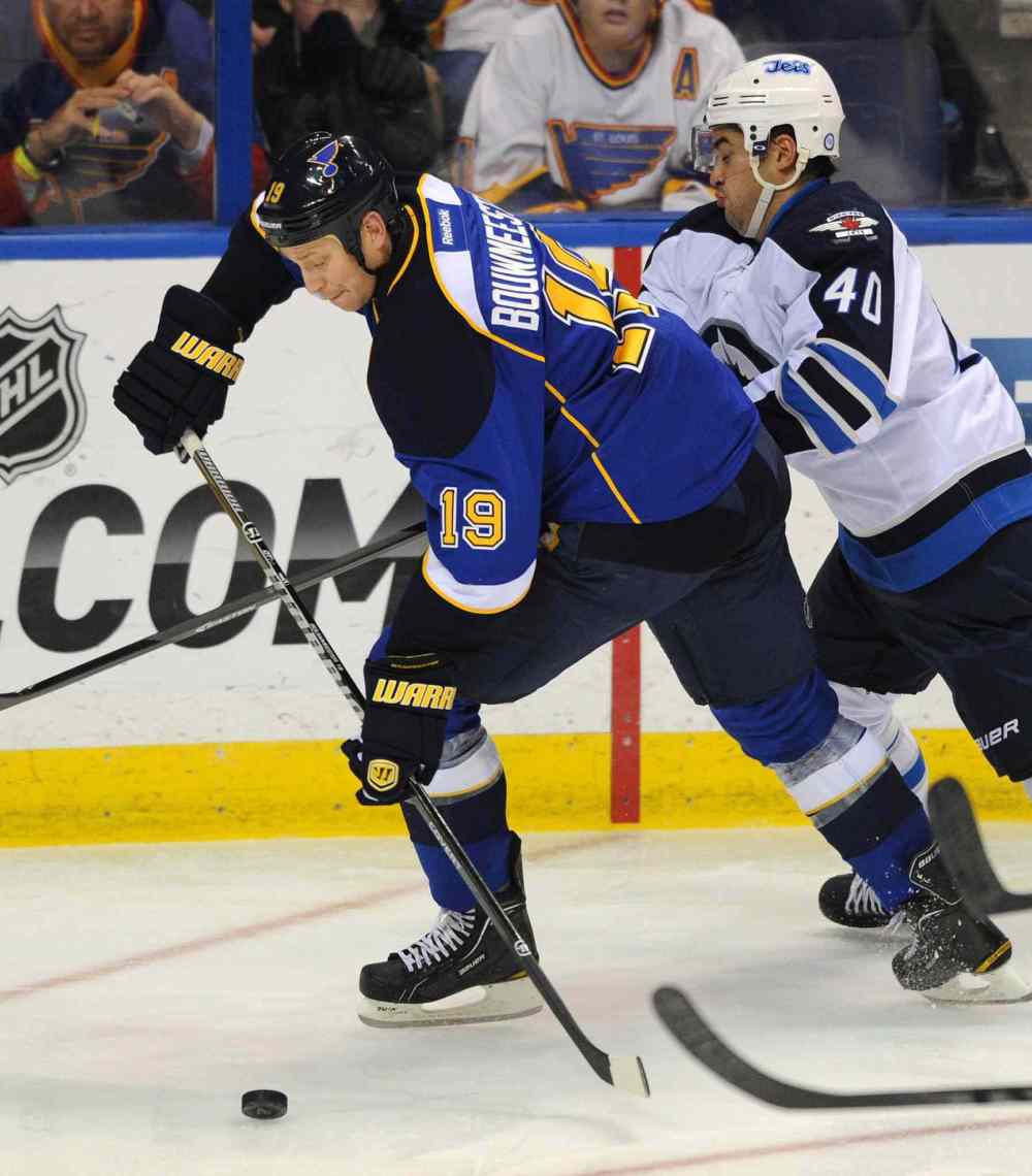 CP
St. Louis Blues' Jay Bouwmeester gets around Winnipeg Jets' Devin Setoguchi in the second period.