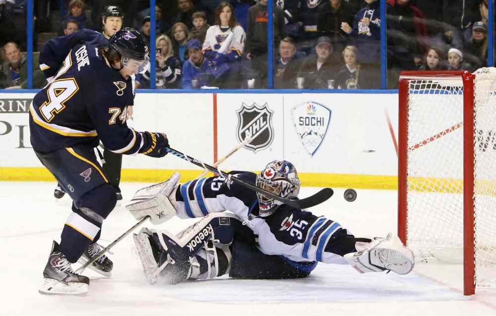 Chris Lee/St. Louis Post-Dispatch/MCT
T.J. Oshie of the St. Louis Blues scores a shootout goal against Winnipeg Jets' goalie Al Montoya to win Saturday's game.