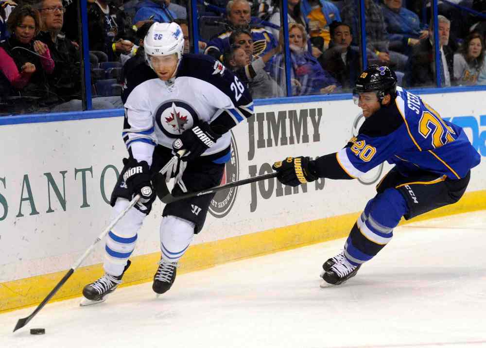 CP
Winnipeg Jets' Blake Wheeler skates by St. Louis Blues' Alexander Steen (20) during the first period.