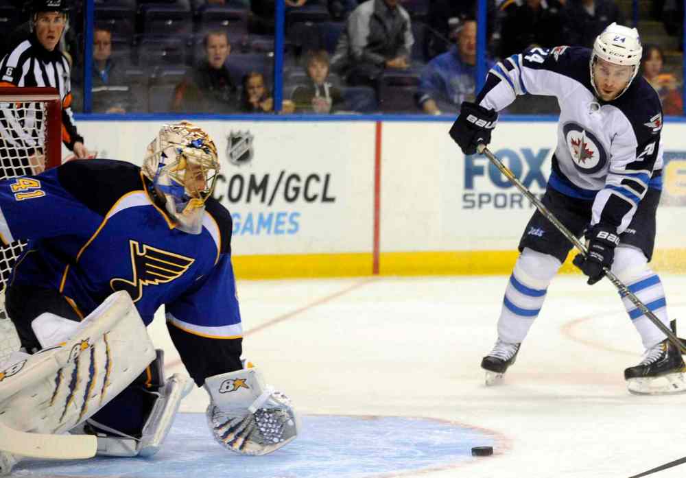 Bill Boyce / the associated press
St. Louis Blues' goalie Jaroslav Halak blocks a shot by Winnipeg Jets defenceman Grant Clitsome in the first period.
