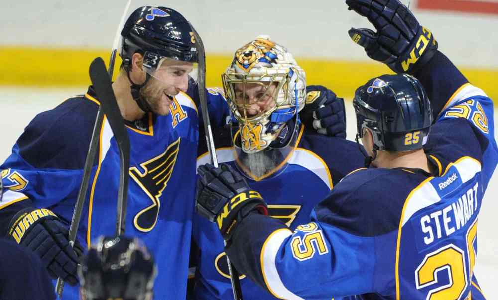 Bill Boyce / the associated press
St. Louis Blues goalie Jaroslav Halak is congratulated by teammates Alex Pietrangelo (left) and Chris Stewart after the Blues' 3-2 victory over the Winnipeg Jets.