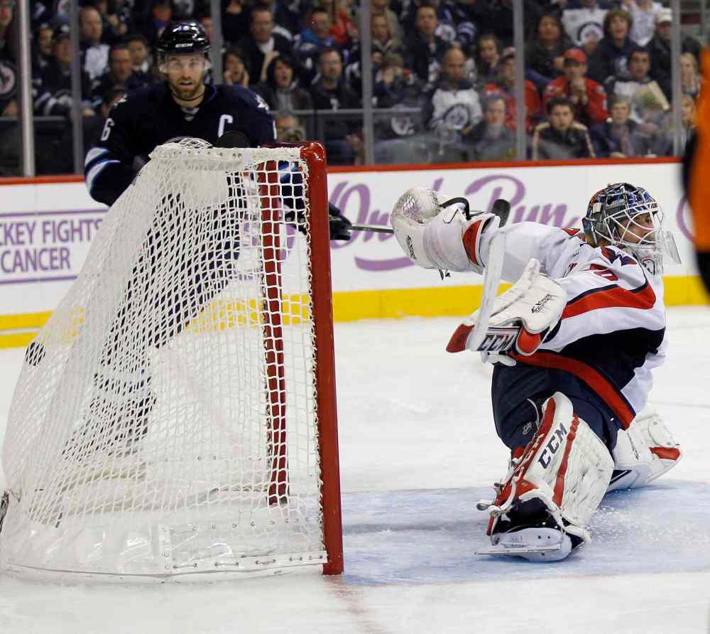 TREVOR HAGAN / THE CANADIAN PRESS
Winnipeg Jets captain Andrew Ladd watches the puck beat Washington Capitals' goaltender Braden Holtby for a goal by Bryan Little in the second period.