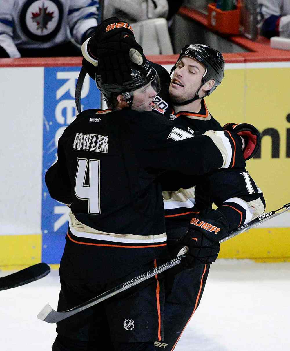 Jae C. Hong / The Associated Press
Anaheim Ducks' Cam Fowler, left, and Ryan Getzlaf celebrate a goal by Fowler during the first period of Tuesday's game against the Winnipeg Jets.