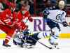 Karl B DeBlaker / The Associated Press
Carolina Hurricanes' Jay Harrison (44) takes Winnipeg Jets' Blake Wheeler (26) off the puck with Olli Jokinen (12) of Finland, during the first period of an NHL hockey game in Raleigh, N.C. on Tuesday.