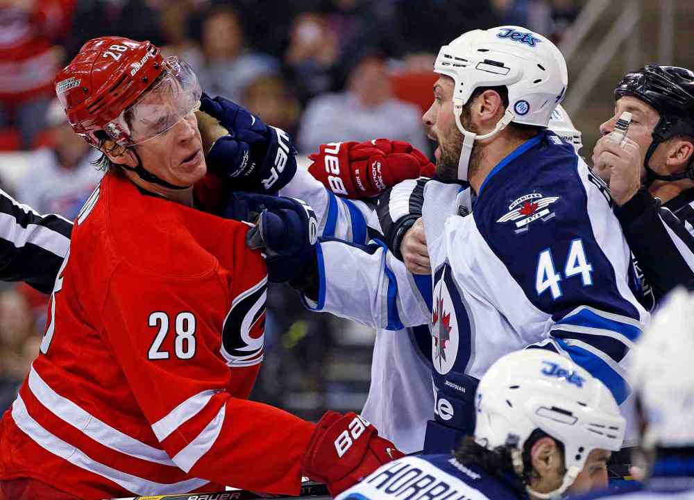 Karl B DeBlaker / The Associated Press
Carolina Hurricanes' Alexander Semin (28) and Winnipeg Jets' Zach Bogosian (44) have a second-period scuffle in front of the net during Tuesday's game.