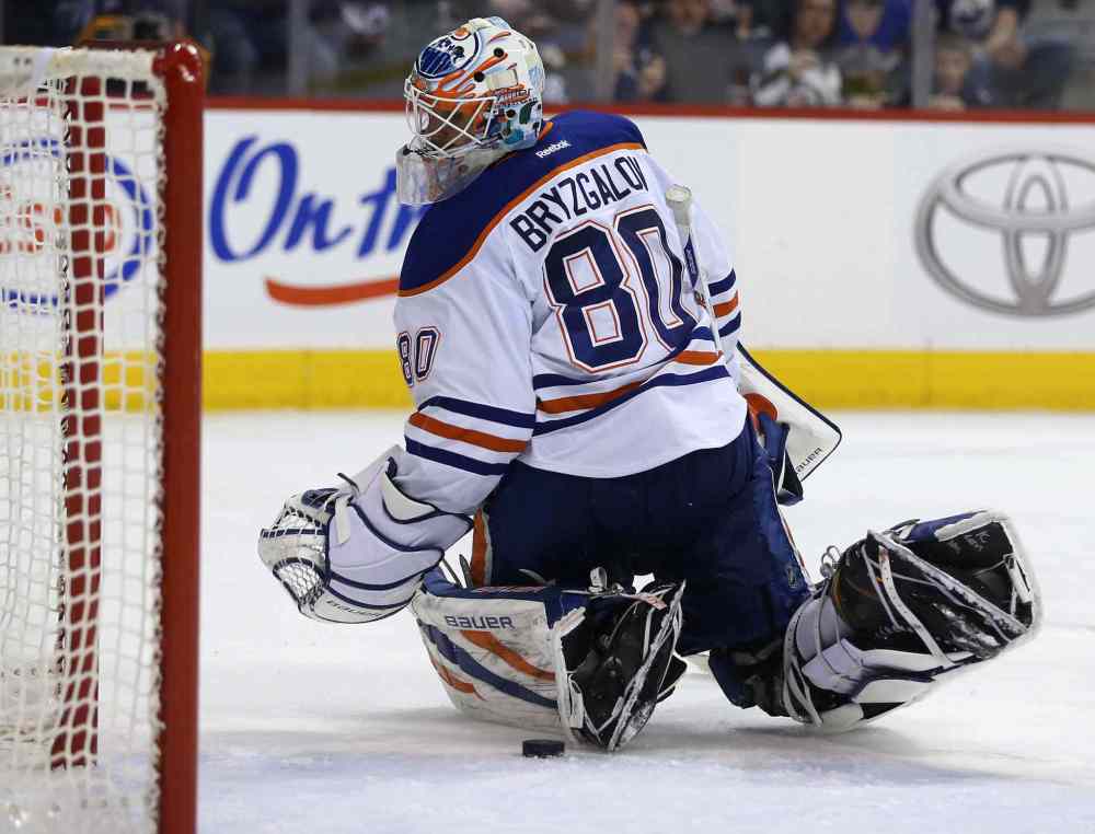 Trevor Hagan / Winnipeg Free Press
Edmonton Oilers' goaltender Ilya Bryzgalov makes an uncertain save on a drive by Winnipeg Jets' Dustin Byfuglien (33) in the second period of Saturday's NHL hockey game in Winnipeg.
