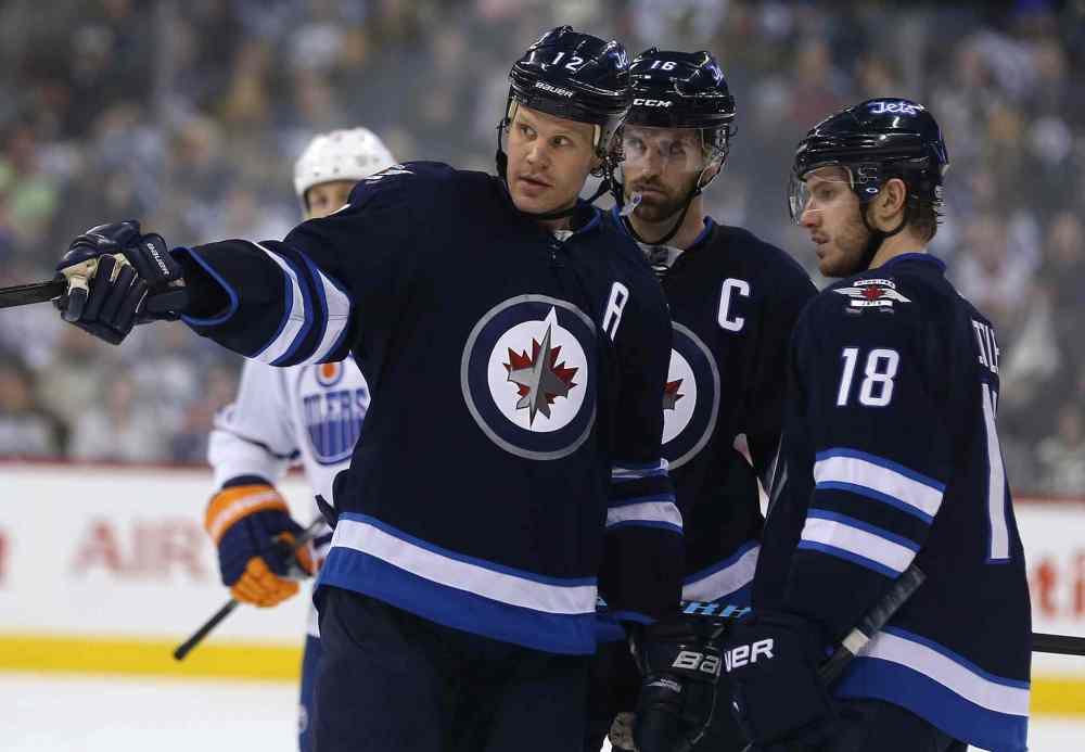 Trevor Hagan / Winnipeg Free Press
Winnipeg Jets' Olli Jokinen (12), Andrew Ladd (16) and Bryan Little (18) plan out the next play against the Edmonton Oilers during the game's second period Saturday at MTS Centre in Winnipeg.