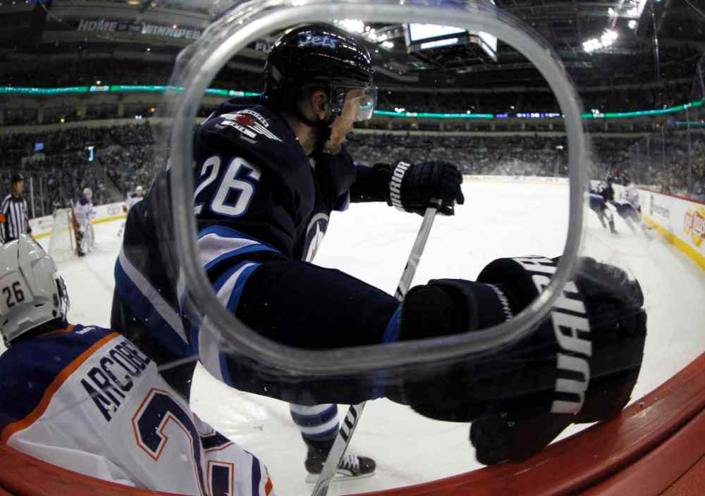 Trevor Hagan / Winnipeg Free Press
Winnipeg Jets' Blake Wheeler (26) hits Edmonton Oilers' Mark Arcobello (26) during the second period of Saturday's NHL game at MTS Centre.