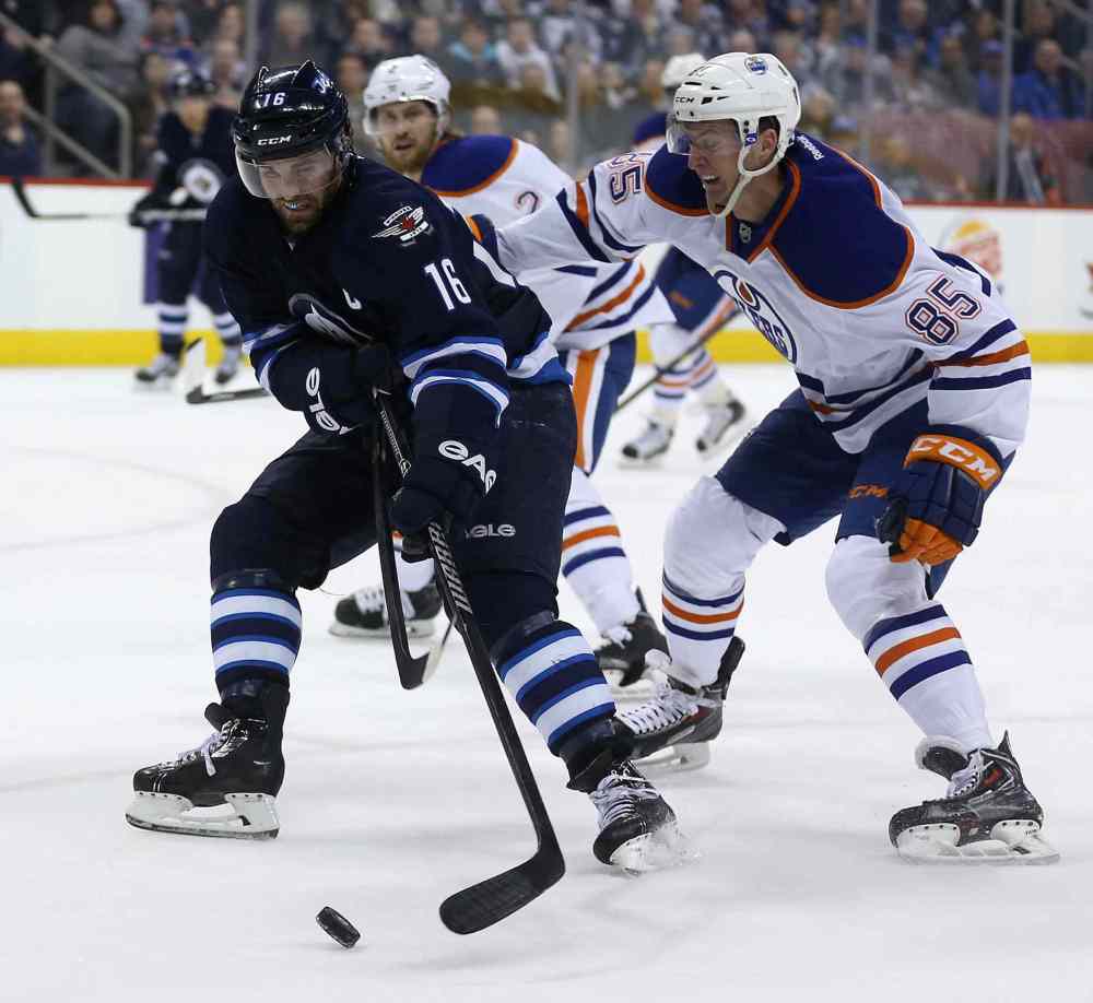 Trevor Hagan / Winnipeg Free Press
Winnipeg Jets' Andrew Ladd (16) drives past Edmonton Oilers' Martin Marincin (85) during second-period NHL play in Winnipeg Saturday afternoon.