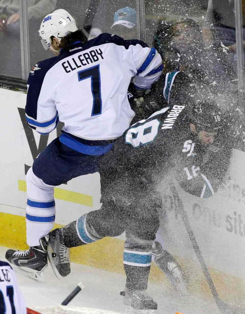 Marcio Jose Sanchez / The Associated Press
Winnipeg Jets' Keaton Ellerby (7) collides against the boards with San Jose Sharks' Mike Brown (18) during the first period of Thursday's game.