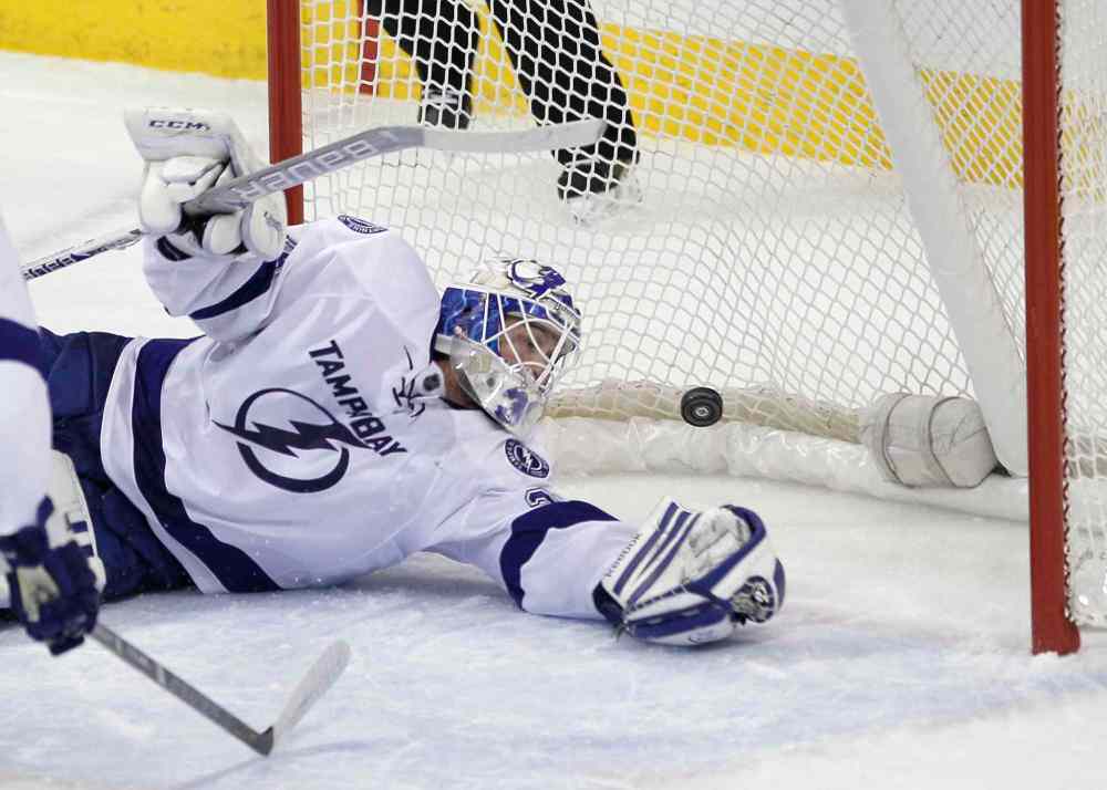 John Woods / Winnipeg Free Press
Tampa Bay Lightning's goaltender Anders Lindback (39) can't stop the shot from Winnipeg Jets' Olli Jokinen (12) during first period of the game at MTS Centre Tuesday.