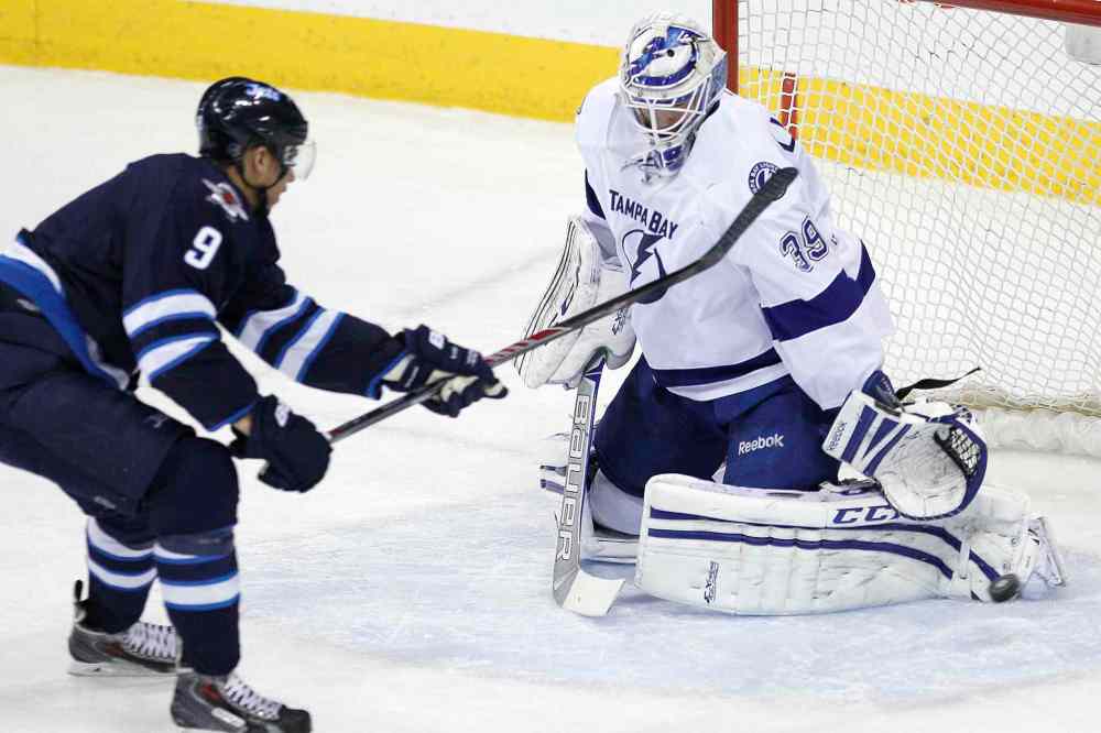 John Woods / Winnipeg Free Press
Winnipeg Jets' Evander Kane (9) gets stopped on the breakaway by Tampa Bay Lightning's goaltender Anders Lindback (39) during the first period Tuesday.