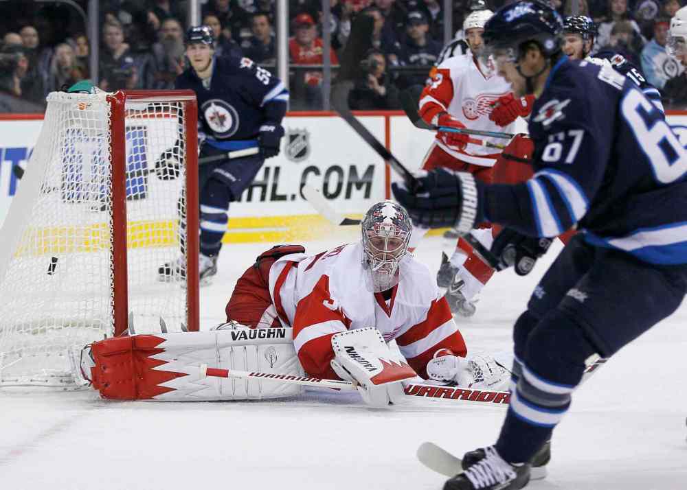 JOHN WOODS / THE CANADIAN PRESS
Winnipeg Jets forward Michael Frolik scores on Detroit Red Wings goaltender Jimmy Howard in the second period.