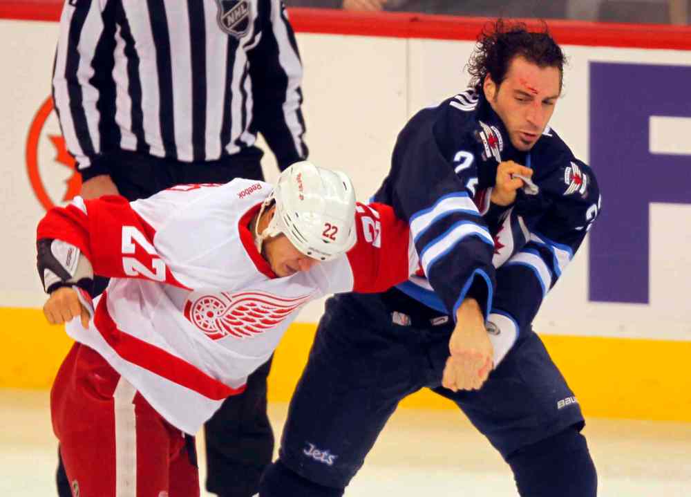 BORIS MINKEVICH / WINNIPEG FREE PRESS
Detroit Red Wings forward Jordan Tootoo opens a gash on Winnipeg Jets forward Chris Thorburn during a first-period scrap.