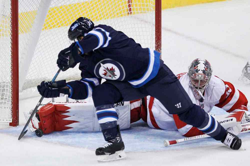 JOHN WOODS / THE CANADIAN PRESS
Winnipeg Jets forward Matt Halishchuk is stopped by Detroit Red Wings goaltender Jimmy Howard in the first period.
