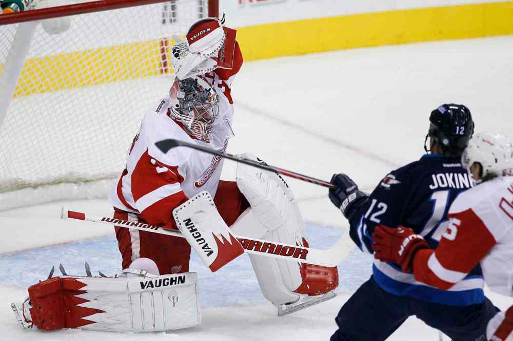 CP
Winnipeg Jets forward Olli Jokinen is robbed by Detroit Red Wings goaltender Jimmy Howard during first-period NHL action.