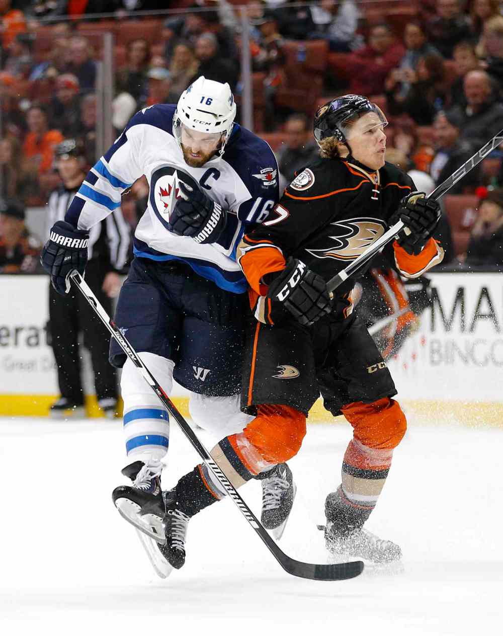 Jae C. Hong / The Associated Press
Winnipeg Jets' Andrew Ladd, left, collides with Anaheim Ducks' Hampus Lindholm during third period.