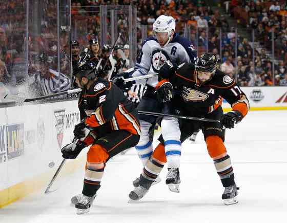 Jae C. Hong / The Associated PressWinnipeg Jets' Blake Wheeler, centre, is defended by Anaheim Ducks' Ryan Kesler, right, and Kevin Bieksa during the third period. The Ducks won 4-1.