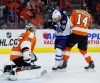 Tom Mihalek / The Associated Press 
Winnipeg Jets' Bryan Little (18) and Philadelphia Flyers' Sean Couturier (14) fight for position as goalie Steve Mason (35) defends in the first period Thursday in Philadelphia.