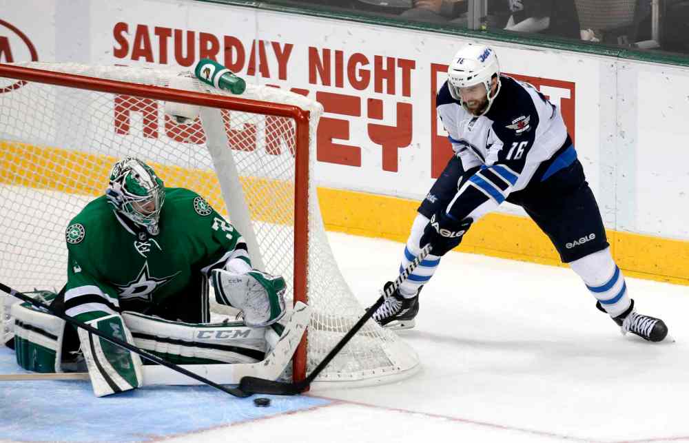 Tony Gutierrez / The Associated Press
Dallas Stars goalie Kari Lehtonen blocks a shot from Andrew Ladd in the third period.