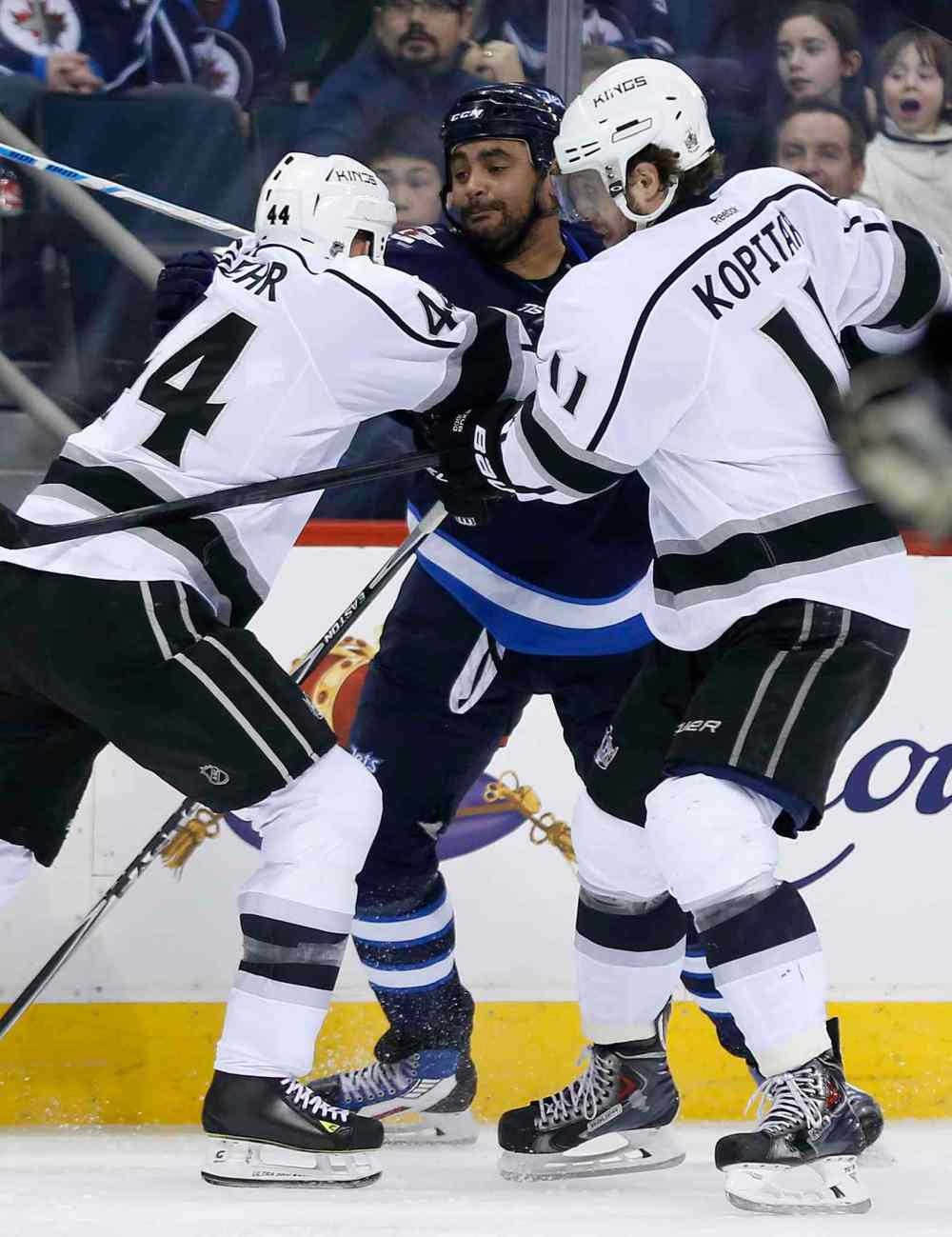 WINNIPEG FREE PRESS
The Winnipeg Jets' Dustin Byfuglien gets double-teamed by Kings skaters Robyn Regehr, left, and Anze Kopitar during the second period.