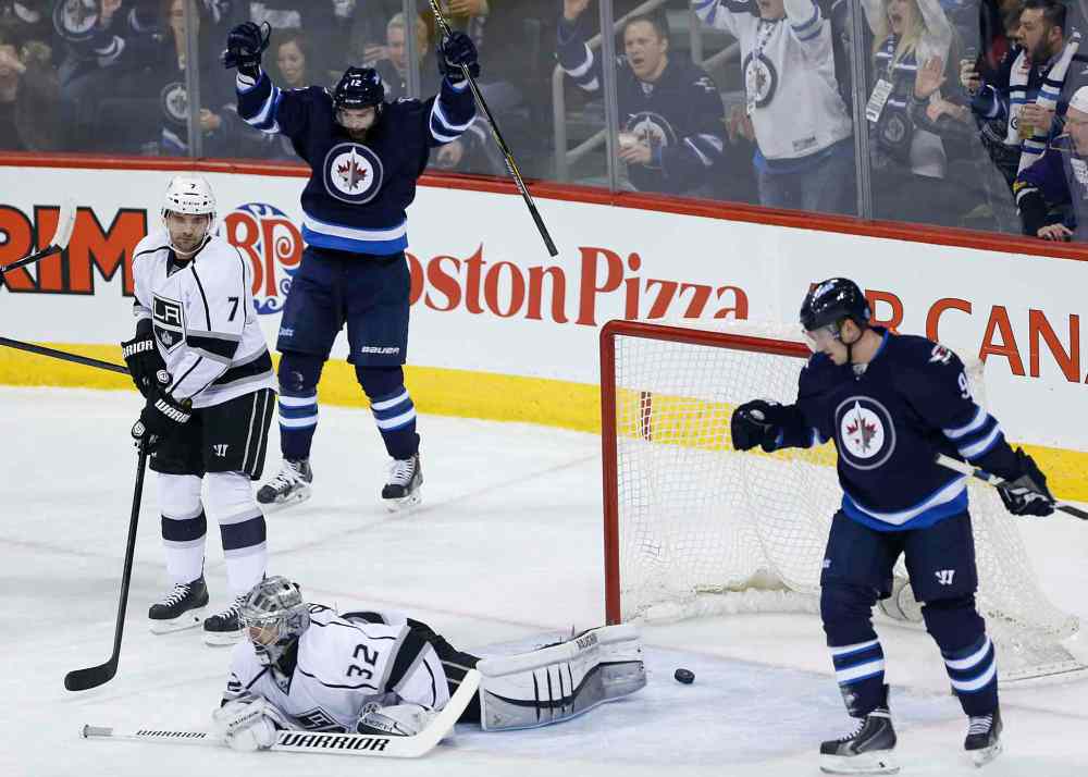 JOHN WOODS / WINNIPEG FREE PRESS
Winnipeg forward Drew Stafford (12) celebrates his goal against Los Angeles goaltender Jonathan Quick as the Kings' Andrej Sekera (7) and the Jets' Jiri Tlusty look on during first-period NHL action.
