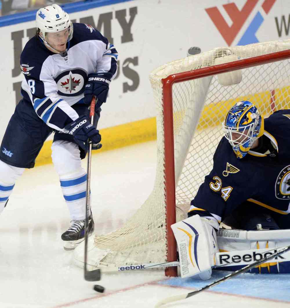 Bill Boyce / The Associated Press
St. Louis Blues' goalie Jake Allen (34) defends against Winnipeg Jets' Jacob Trouba (8) during the second period of Tuesday's game.