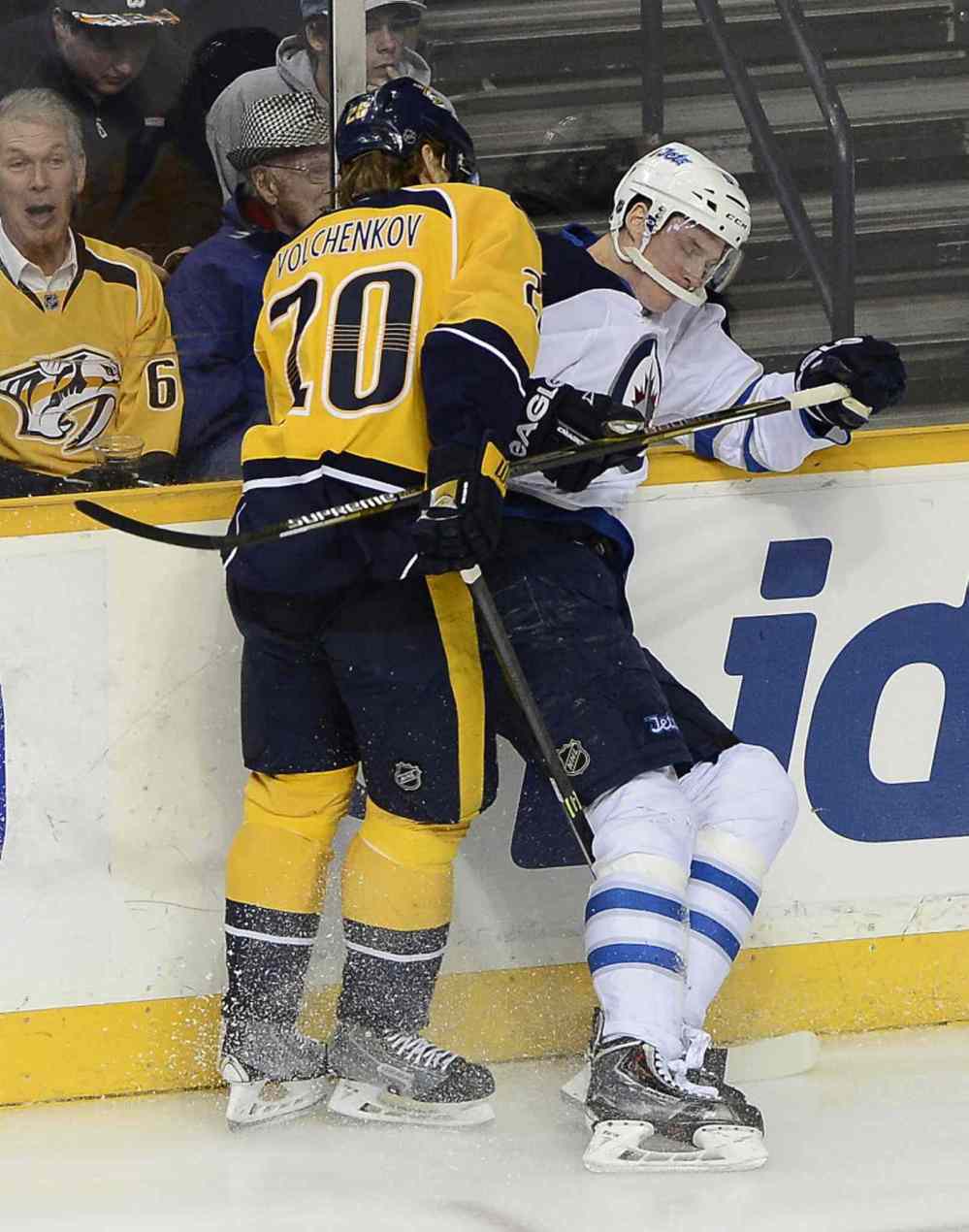 Mark Zaleski / The Associated Press
Nashville Predators' defenceman Anton Volchenkov (20) collides with Winnipeg Jets defenceman Tyler Myers in the first period of Thursday's game in Nashville.
