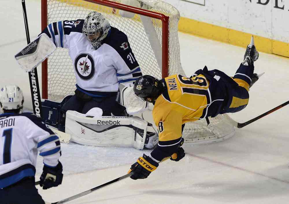 Mark Zaleski / The Associated Press
Nashville Predators left wing James Neal (18) scores a goal against Winnipeg Jets goalie Ondrej Pavelec (31) in the third period of Thursday's game.
