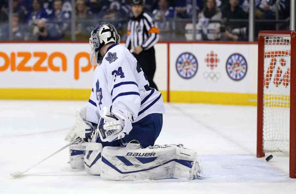 Trevor Hagan / Winnipeg Free Press
A shot by Winnipeg Jets' Zach Bogosian (44) gets past Toronto Maple Leafs' goaltender James Reimer (34) during the second period of Saturday's game.