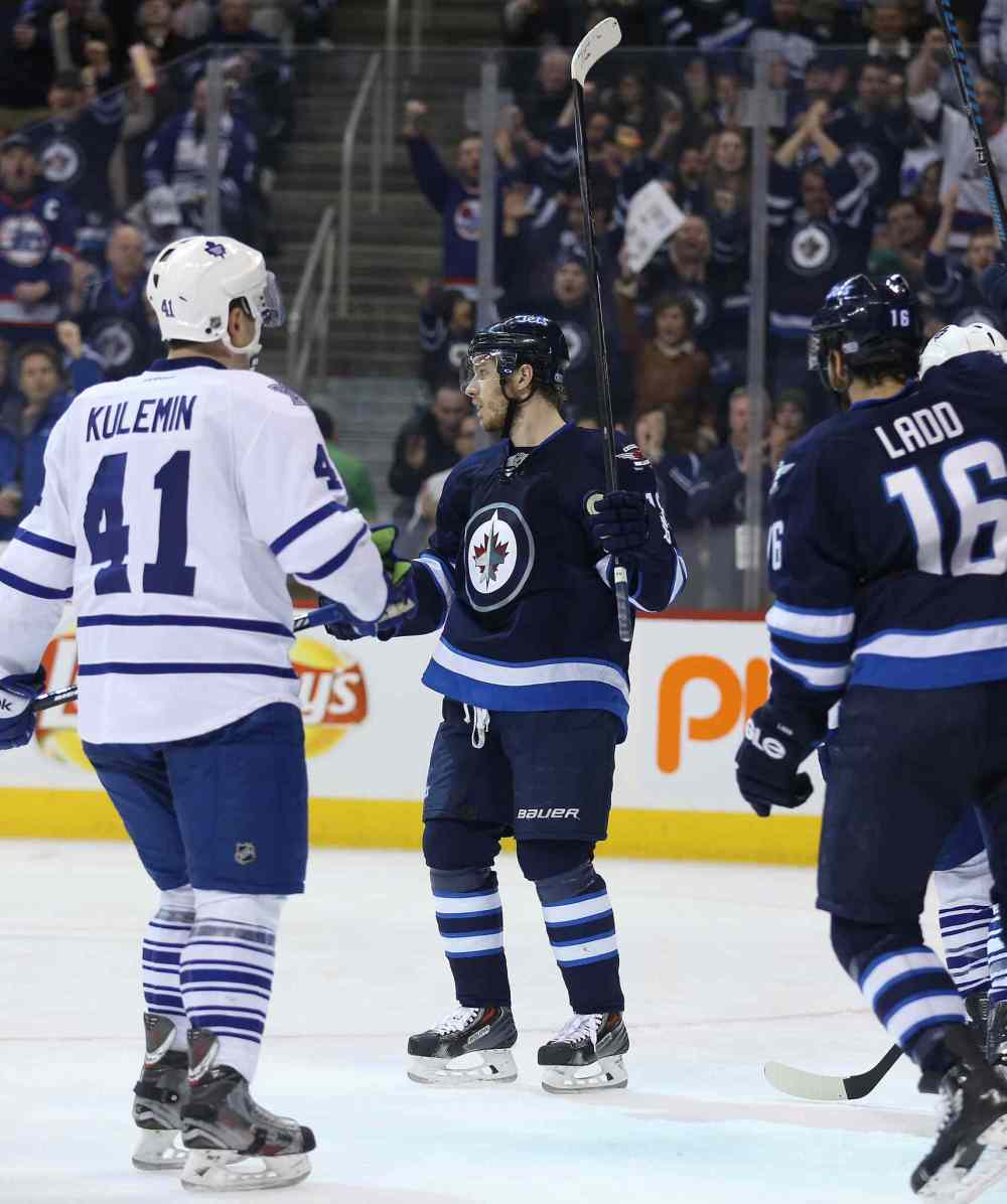 Trevor Hagan / Winnipeg Free Press
Winnipeg Jets' Bryan Little (18) celebrates his second-period goal against the Toronto Maple Leafs during Saturday's game at the MTS Centre.