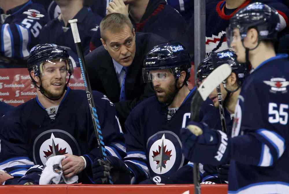 Trevor Hagan / Winnipeg Free Press
Winnipeg Jets' head coach Paul Maurice has a second-period chat with Bryan Little (18) and Andrew Ladd (16) on the bench as the team plays the Toronto Maple Leafs in Winnipeg Saturday.