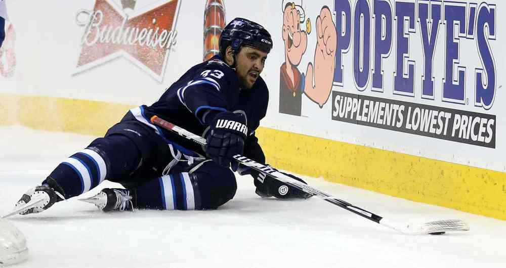 TREVOR HAGAN/WINNIPEG FREE PRESS
Winnipeg Jets' Dustin Byfuglien (33) is tripped up behind the Toronto Maple Leafs' net during the second period of Saturday's game.