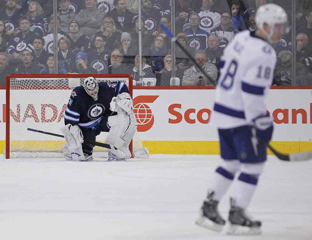 John Woods / Winnipeg Free Press
Winnipeg Jets' goaltender Ondrej Pavelec (31) hangs his head after being scored on by Tampa Bay Lightning's Ondrej Palat (18) during second period.