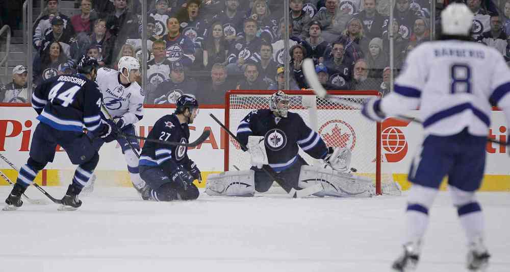 John Woods / Winnipeg Free Press
Winnipeg Jets' goaltender Ondrej Pavelec (31) can't stop the shot from Tampa Bay Lightning's Ondrej Palat (18) during second period.